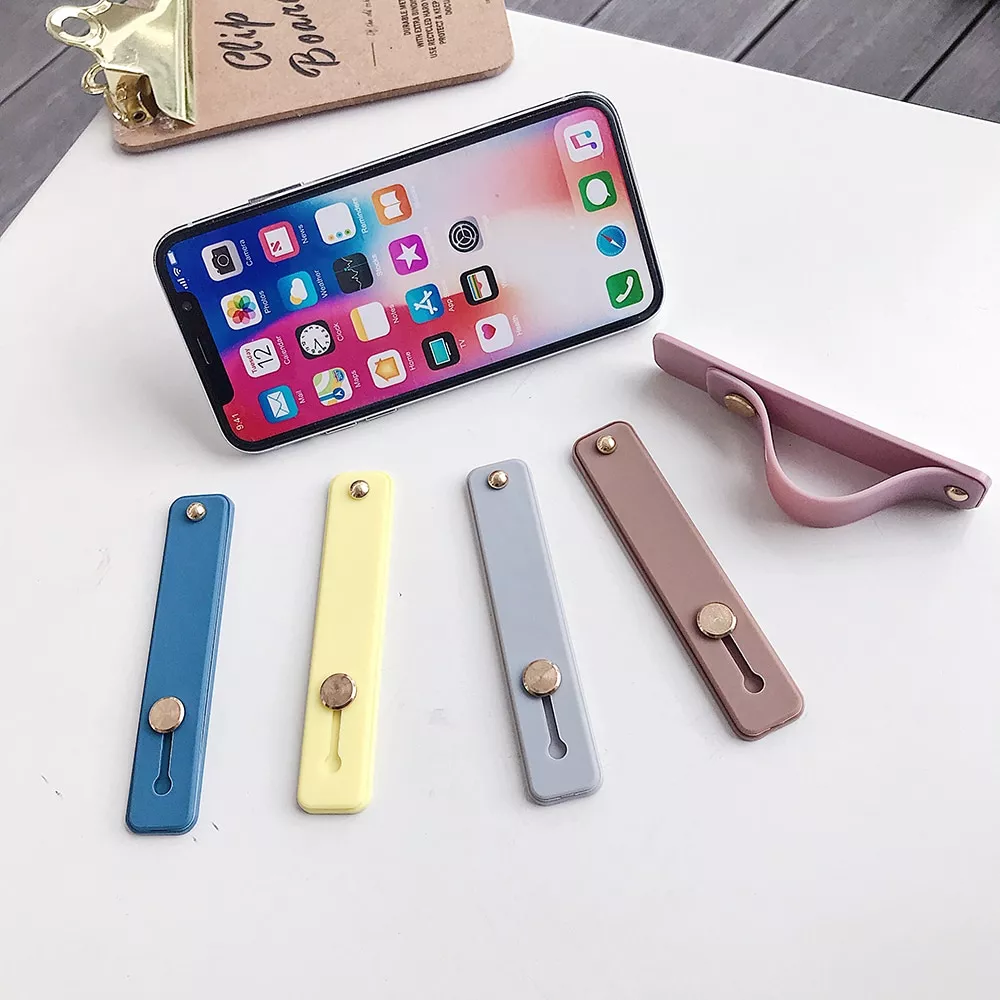 Suporte de banda de mão do telefone de silicone universal anel de dedo push pull aperto suporte de cor doce pulseira cinta push pull suporte
